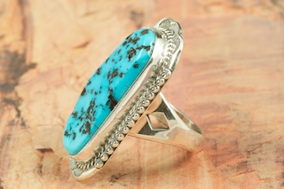 Genuine Sleeping Beauty Turquoise set in Sterling Silver. Created by Navajo Artist John Nelson. Signed by the artist. The Sleeping Beauty Turquoise mine is located in Gila County, Arizona.